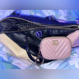 Stylish LOGO by Lori Goldstein Black and Cream Bag with Pink Accent.